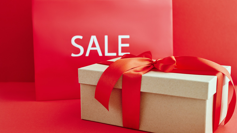 Cardboard box with red ribbon