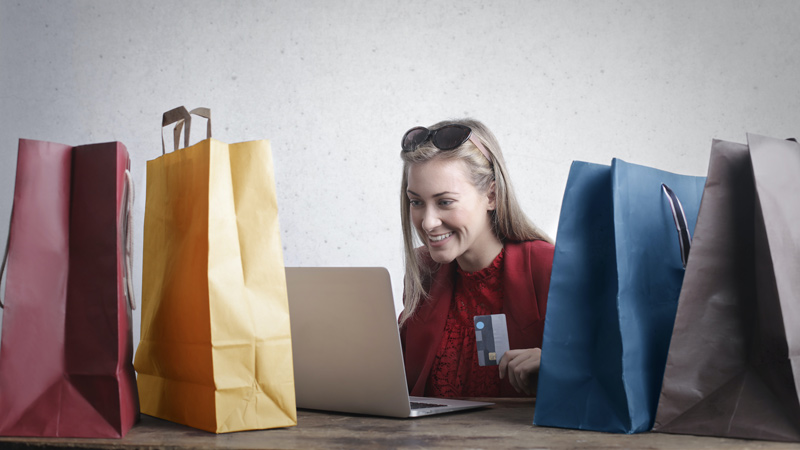 Happy woman shopping online