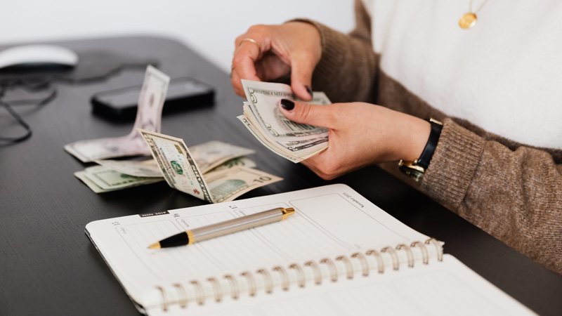 crop payroll clerk counting money